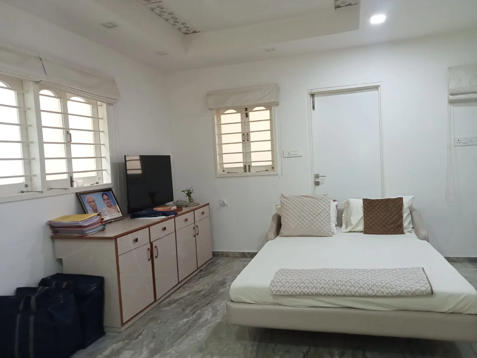 Furnished bedroom with built-in storage