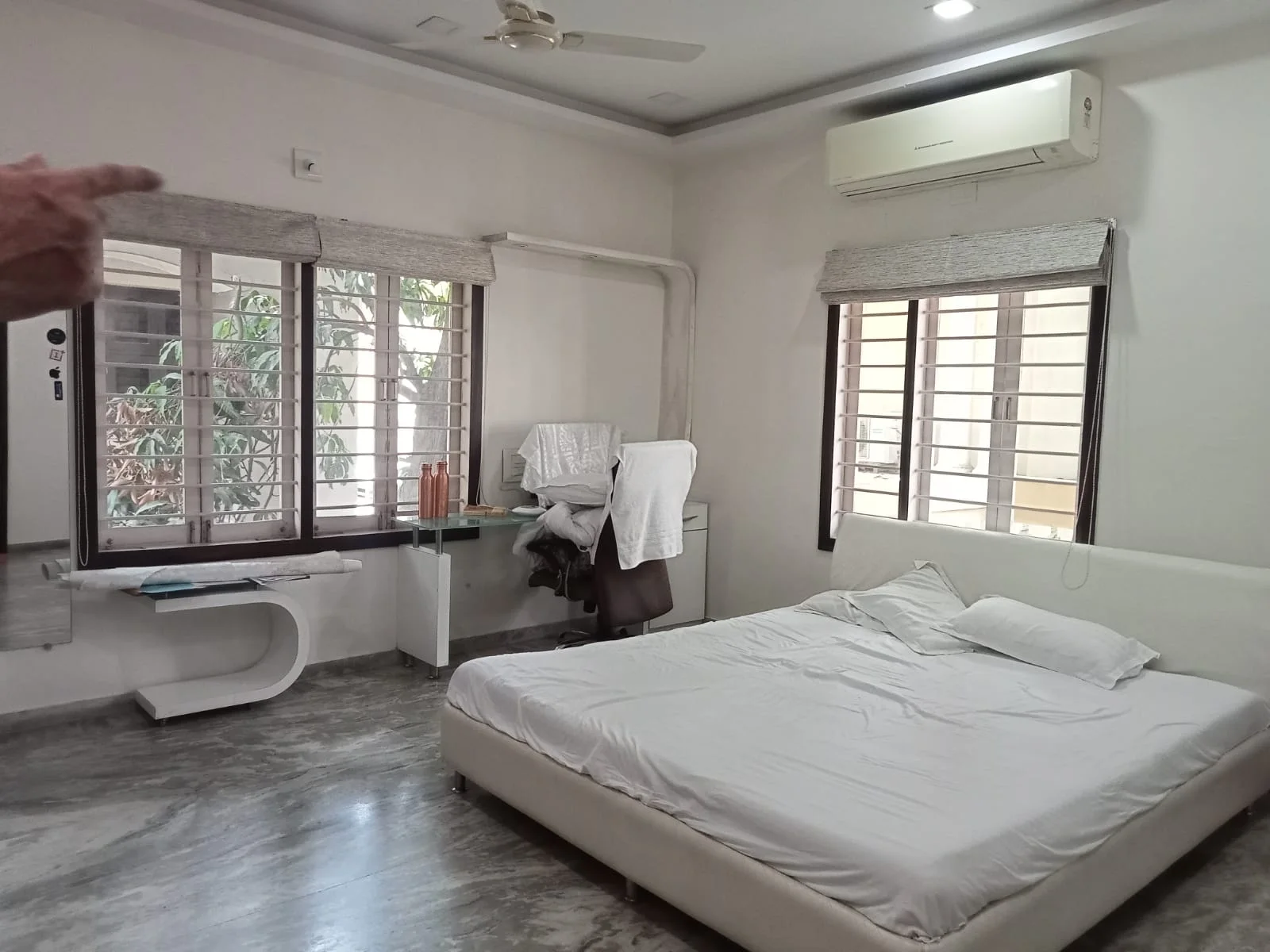 Bright furnished bedroom with central air conditioning